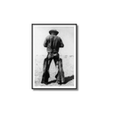 Framed black and white photo of a person wearing a hat and jacket on a white background