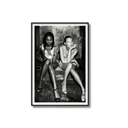 Framed black and white photo of two women sitting together.